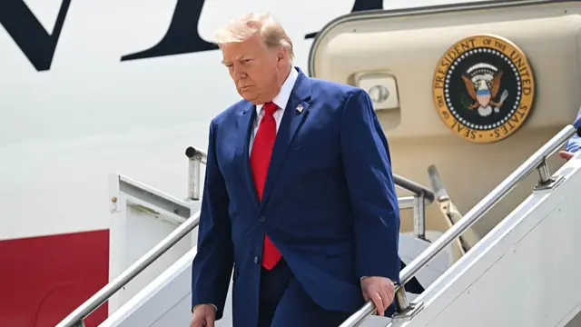 S President Donald Trump disembarks from Air Force One upon arrival at Dobbins Air Reserve Base in Marietta, Georgia, July 22, 2026. Trump is travelling to Wheeler High School in Marietta, Georgia, to deliver remarks
