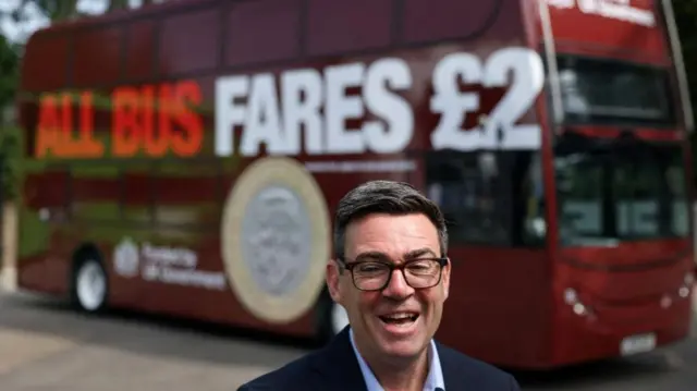 Britain's Prime Minister Andy Burnham reacts in front of a FirstGroup bus at the bus station during an interview in Bath, Britain, July 22, 2026.