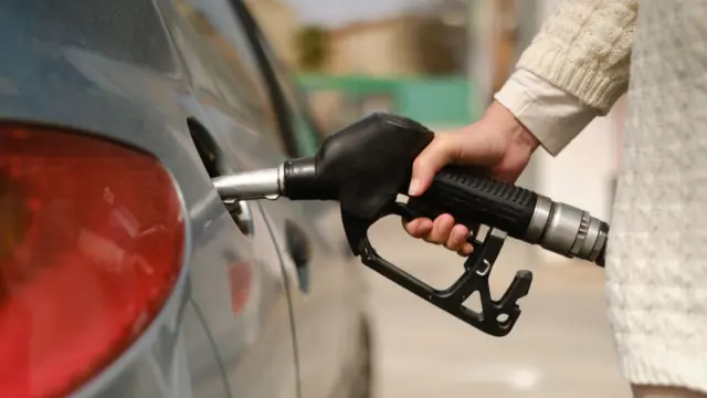 Woman with petrol pump