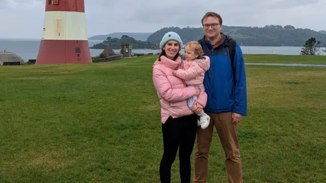 Katerina Bowes pictured with her husband and their child
