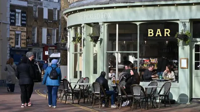 People sit outside a restaurant