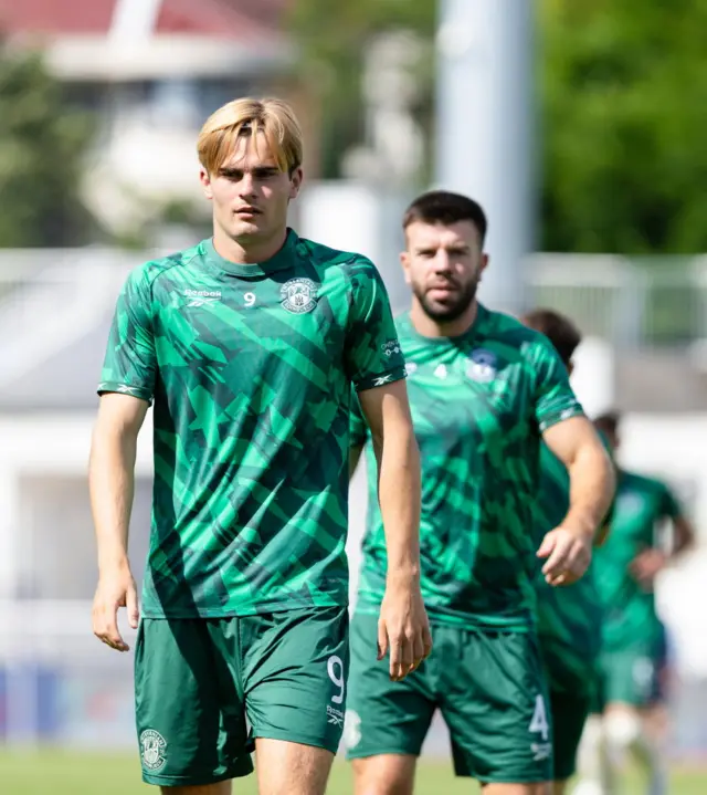 Hibernian's Nathan Lowe (L) and Grant Hanley warm up ahead of a UEFA Conference League Second Qualifying Round First Leg match between KF Malisheva and Hibernian at Fadil Vokrri Stadium, on July 23, 2026 in Pristina, Kosovo.