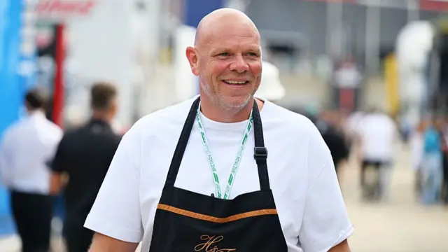 Tom Kerridge in a white t-shirt and black apron