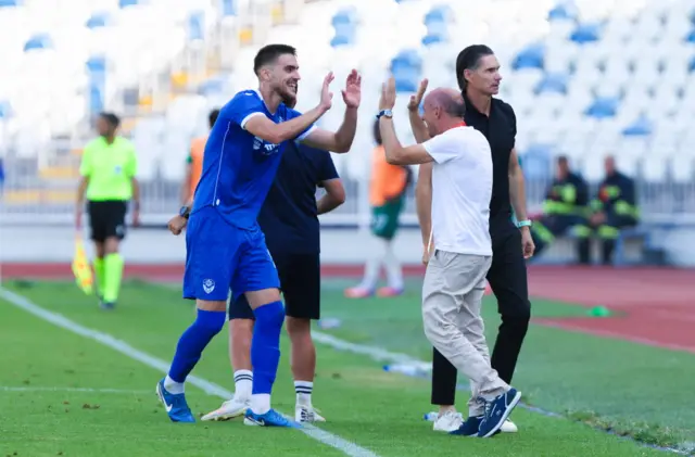 Malisheva's Keslin Shani celebrates with coaching staff after Kreshnik Uka's scored to make it 1-0