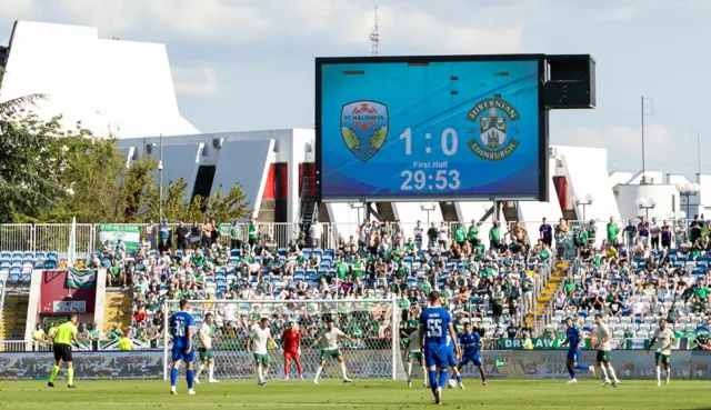 A general view of the stadium with the scoreboard depicting Malisheva leading 1-0 against Hibernian during a UEFA Conference League Second Qualifying Round First Leg