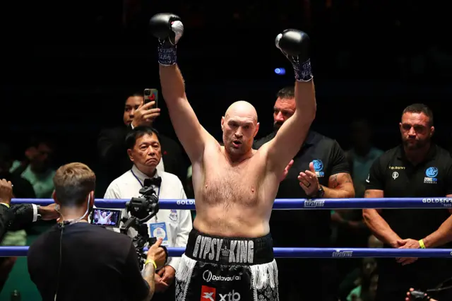 Tyson Fuiry with his hands in the air