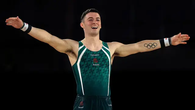 Rhys McClenaghan celebrates the end of his routine