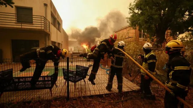 Firefighters work to extinguish flames during a wildfire in Lege-Cap-Ferret in the Gironde department, amongst worsening drought conditions following a heatwave and water shortages across much of France, July 24, 2026.