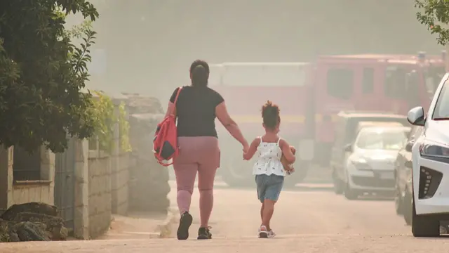 A mother and her daughter walk hand in hand on 24 July 2026 in Burgohondo, Avila, Castile and Leon, Spain.