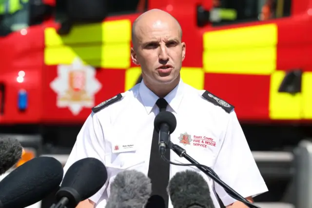 Rick Hylton, Chief Fire Officer for Essex County Fire and Rescue Service, reads a statement to the media at Great Baddow Fire Station, Essex,