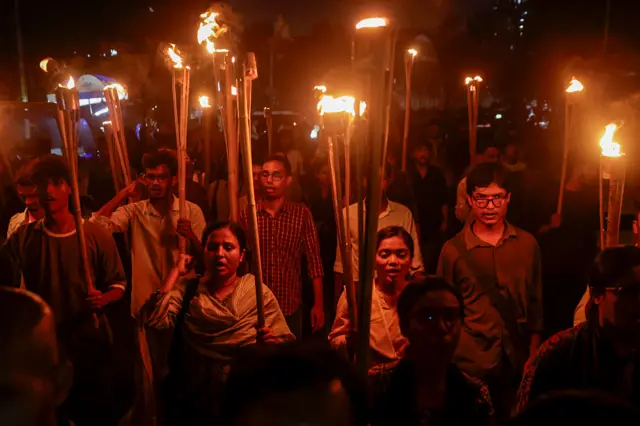 Students Hold Solidarity Rally For India Protests Members of the Democratic Students' Alliance carry flaming torches during a rally at Dhaka University in Dhaka, Bangladesh, on July 23, 2026, in solidarity with protests in India led by the social media-driven Cockroach Janta Party (CJP) movement. The demonstration followed a pledge by Indian Prime Minister Narendra Modi to impose ''stringent punishment'' on those responsible for leaking examination papers, a scandal that has sparked nationwide protests challenging his administration. (Photo by Syed Mahamudur Rahman/NurPhoto via Getty Images)