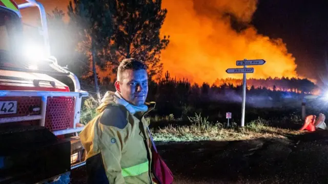 A handout photo made available by the French Landes Prefecture shows firefighters at the scene of a forest fire in Biscarrosse, southern France, 25 July 2026.