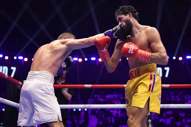 Hamzah Sheeraz getting punched by Simon Zachenhuber