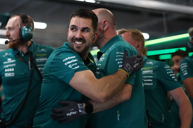 Aston martin crew celebrate Fernando Alonso amking it through to Q2 in Hungary