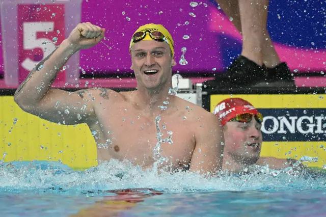 Sam Williamson of Australia celebrates with Adam Ramsay-Peaty in the background