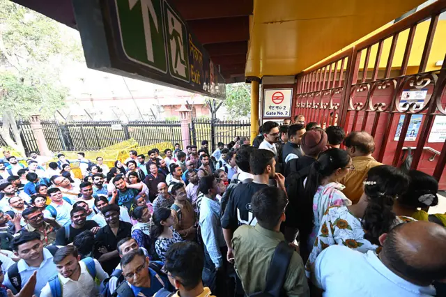 The Crowd of commuters seen outside the closed gate to Delhi metro's Central Secretariat metro station seen on Thursday