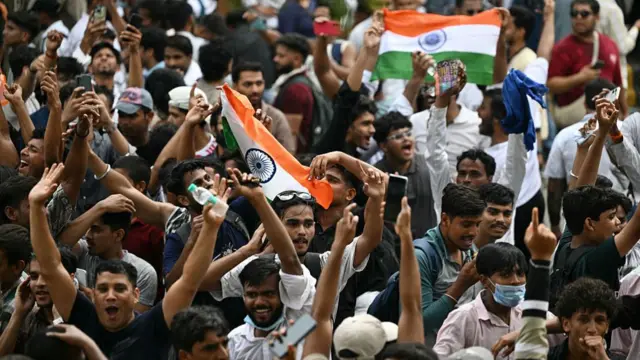 Cockroach Janta Party (CJP) supporters celebrate the resignation of India's Education Minister Dharmendra Pradhan, at Jantar Mantar in New Delhi on July 25, 2026