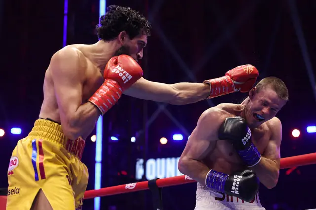 Hamzah Sheeraz punches Simon Zachenhuber