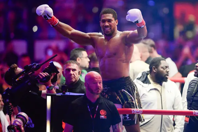 Anthony Joshua with his hands in the air