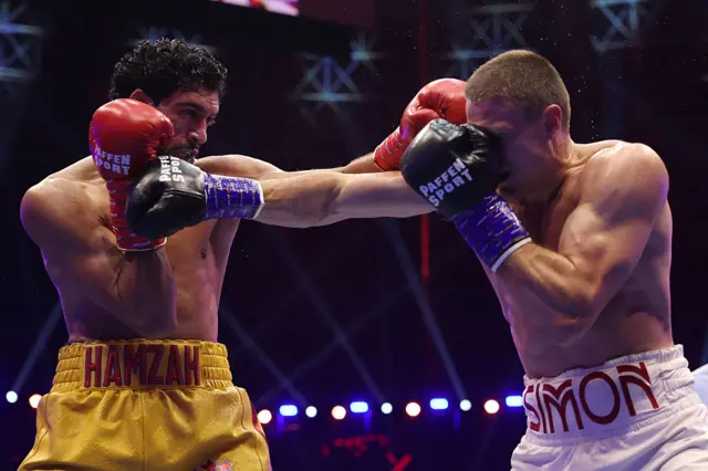 Hamzah Sheeraz punches Simon Zachenhuber
