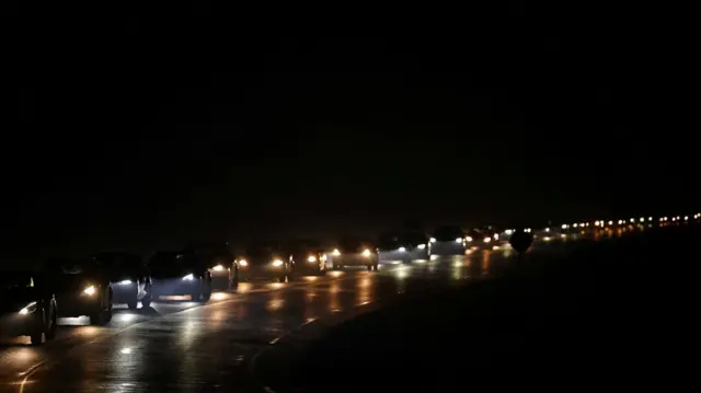 A traffic jam of vehicles evacuating Saint-Aubain-de-Medoc as a wildfire burns nearby amid worsening drought conditions following a heatwave and water shortages across much of France, July 25, 2026.