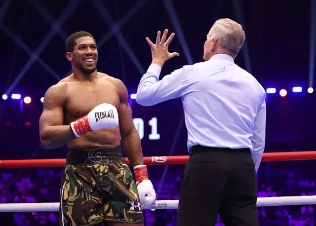 Anthony Joshua being counted by the referee