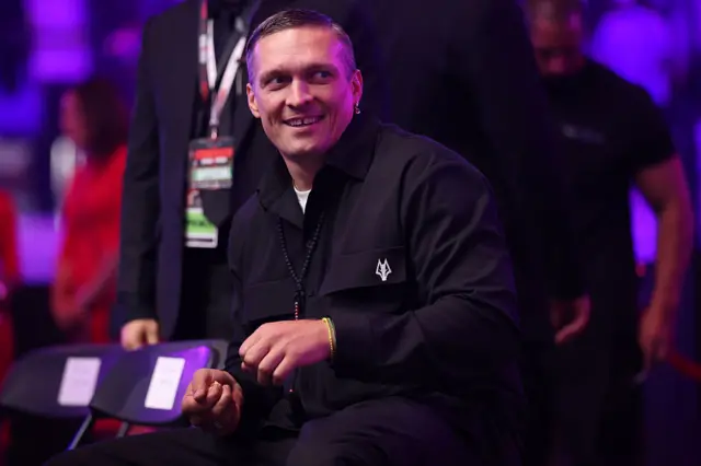 Oleksandr Usyk sitting ringside in Jeddah