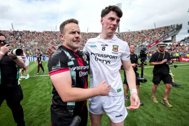 Andy Moran celebrates with Bob Tuhoy