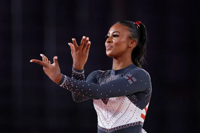 Shantae-Eve Amankwaah of Team England gestures during her Floor Exercise