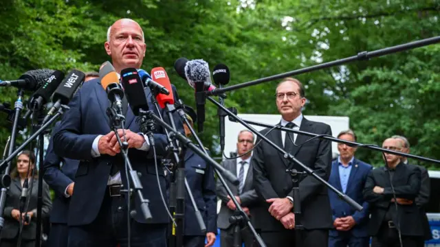 Berlin mayor Kai Wegner speaks to the media, flanked by German Interior Minister Alexander Dobrindt