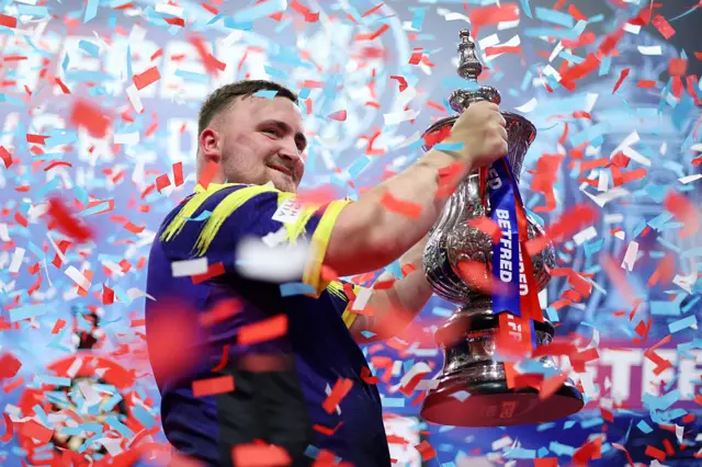 Luke Littler with World Matchplay trophy in 2025