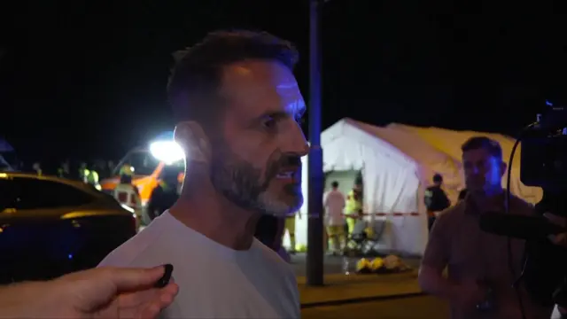 Man who attended Pride event speaks to journalists near scene