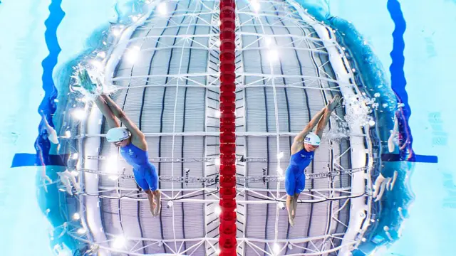 Ciara Schlosshan of Team Scotland and Keanna MacInnes of Team Scotland compete during the Women's 100m Butterfly