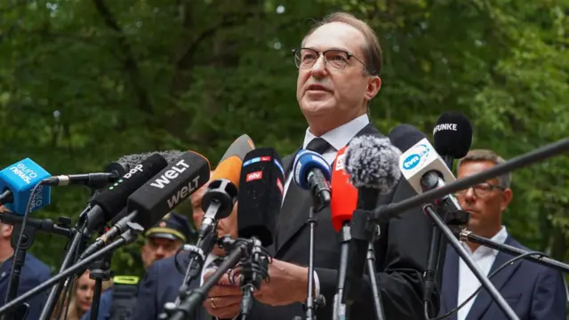 German Interior Minister Alexander Dobrindt speaks at a news conference near the scene where a vehicle plowed into a crowd on the sideline of the Christopher Street Day (CSD) parade in Berlin