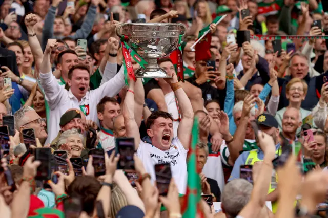 Jack Coyne lifts the Sam Maguire
