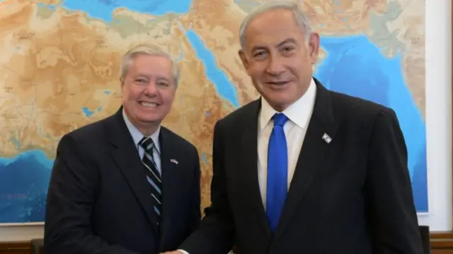 Late Senator Lindsey Graham (left) and Israeli PM Benjamin Netanyahu shake hands and smile for a photo