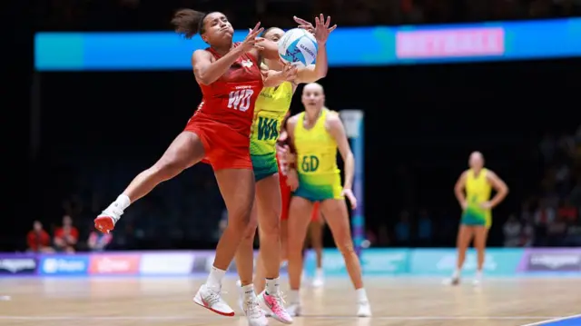Imogen Allison of Team England battles for the ball with Liz Watson of Team Australia during the Netball