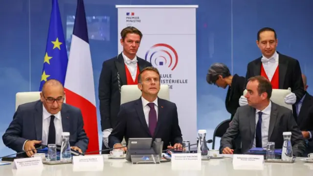 French President Emmanuel Macron sits next to Prime Minister Sebastien Lecornu and Interior Minister Laurent Nunez as he attends a meeting with members of the cabinet to discuss wildfires in the country, at the Hotel de Beauvau, headquarters of the Interior Ministry, in Paris, France, July 27, 2026