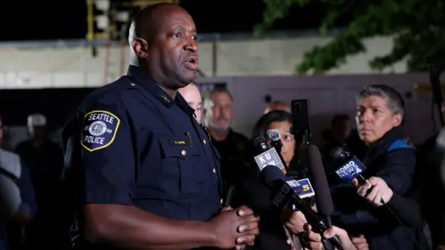 Tyrone Davis, Assistant Chief of Special Operations for the Seattle Police Department, speaks to the members of the media