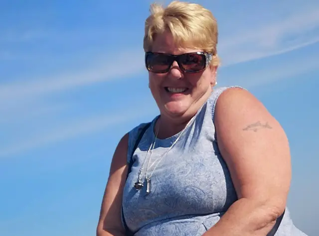Woman in blue top