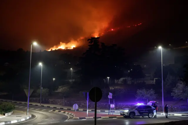 Fires burning on a hill