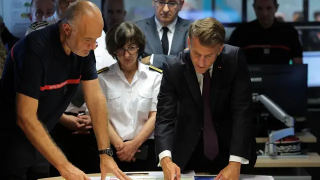 Emmanuel Macron attends a situation briefing in the crisis room at the Departmental Fire and Rescue Operational Center (CODIS) in Bordeaux,