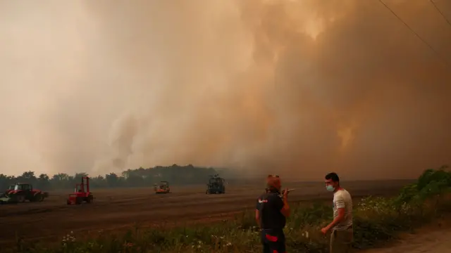 Smoke rises from a wildfire in Pierroton, Gironde, France