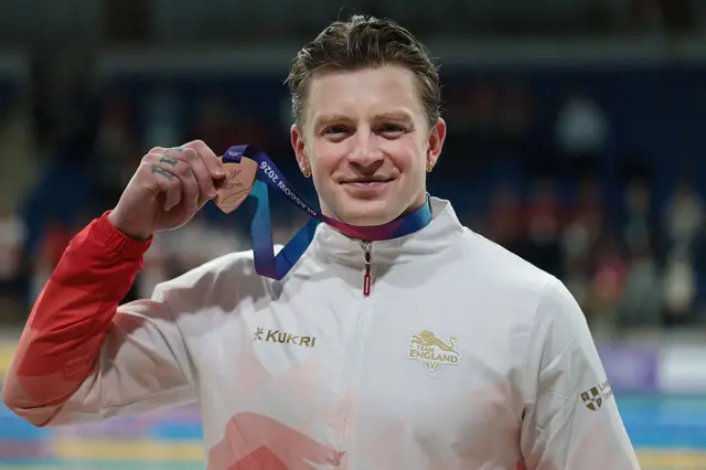 Adam Ramsay-Peaty of Team England poses with his bronze medal
