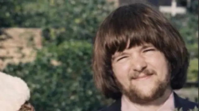 A man dressed for a wedding