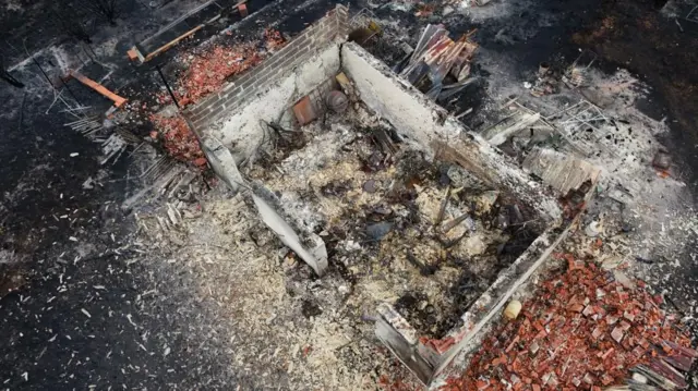 Buildings destroyed by fire in Le Porge, Gironde.