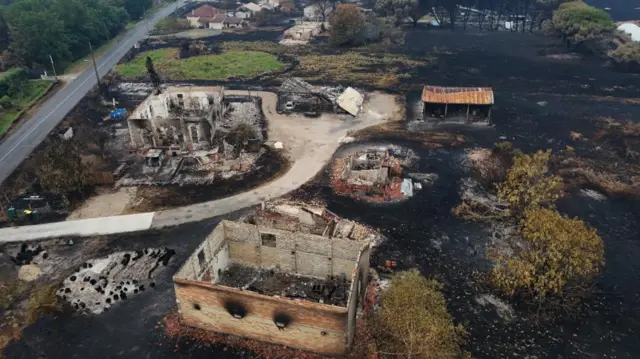 Buildings destroyed by fire in Le Porge, Gironde.