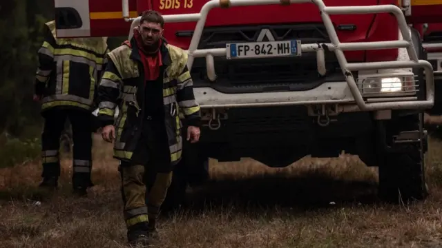 Firefighters in a forest between Cestas and Marcheprime, southwest France, 27 July 2026.