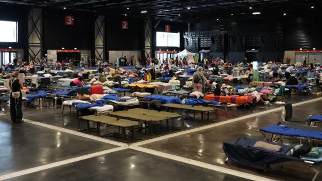 Camp beds in exhibition centre
