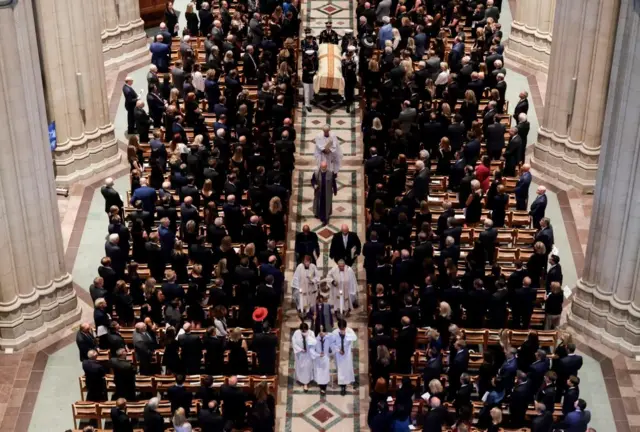 An aerial shot of the procession out of the funeral of Lindsey Graham at Washington National Cathedral